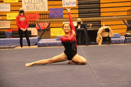 Lilly Clarke strikes a pose, ending her routine with a score of 09.40 out of 10.00 and earning the sixth place floor spot at Districts.