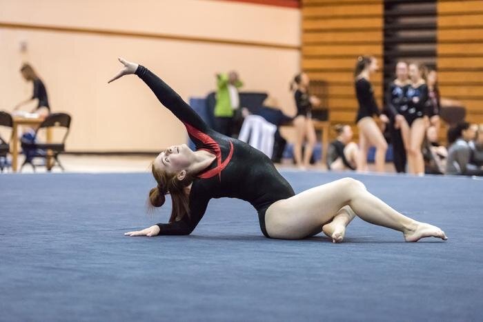 Jay DotsonSophomore Avery Miller performs a floor routine during a meet earlier this year. Miller placed 26th on the beam at the state tournament.