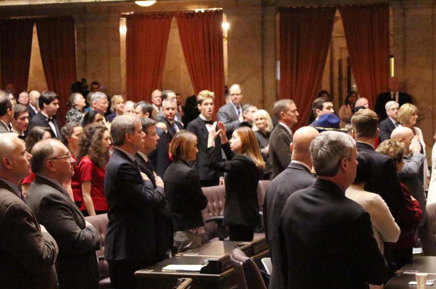 Henry BurresonDirector of Choirs Courtney Pelavin leads Concert Choir in their performance of the National Anthem at the State of the State Address in Olympia, Jan. 2.
