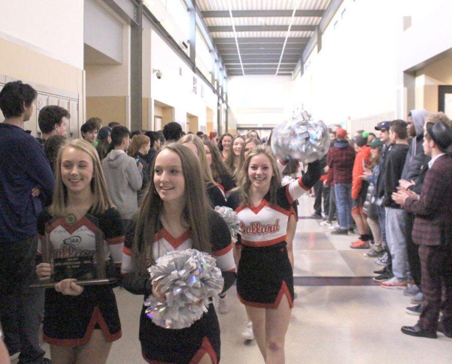 Miles WhitworthThe cheer team returned as state champs and were given a “clap up” to celebrate, where the students congregated in the hallways and applauded as the team paraded by.