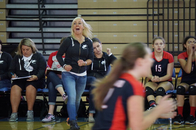 Varsity Head Coach Tami Reese, celebrates during the volleyball team’s semi-final match against Eastside Catholic. Reese was named coach of the year this season. (Olivia Knoll)