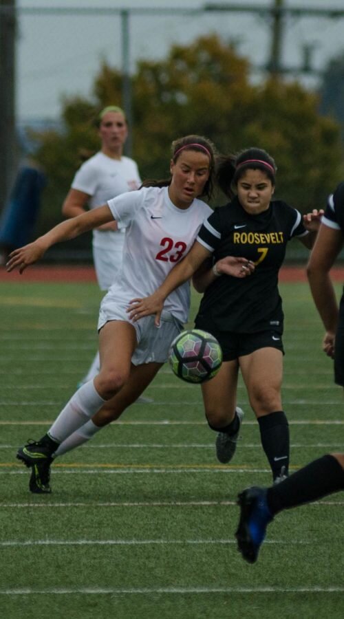 Junior Elena Milam fights for the ball in a game against Roosevelt during the fall 2016 season. (Shingle Archives)