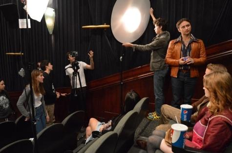 Courtesy of Victoria O’LaughlinDirector of Photography Leo Pfeifer advises Production Assistant Miles Andersen on bouncing light onto actor James Kazan (Tony Taglioni) as co-producers Jaya Flanary and Sho Schrock approve of the shot composition.