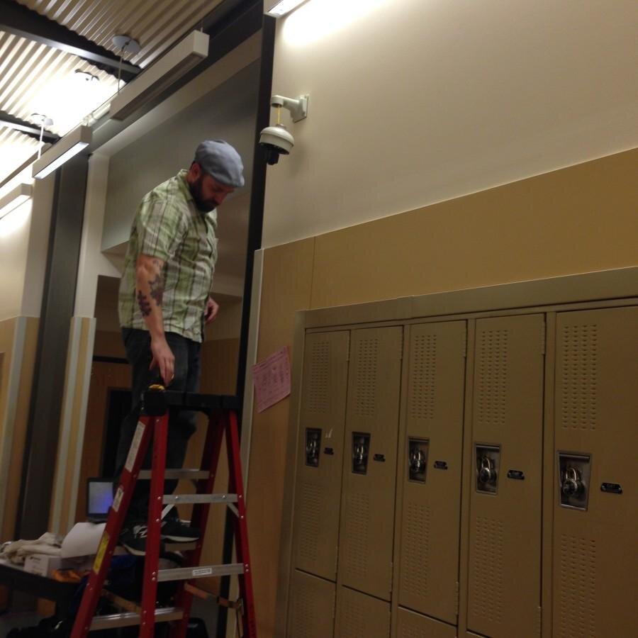 Elliot Bailey SPS Electronic Technician Cormac Pope works with one of the 50 security cameras to be installed at Ballard High School in the next few weeks. New cameras are going in schools across the SPS district.
