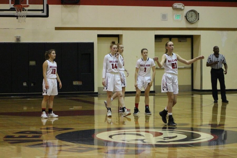 From left to right: sophomore Madeline Angelos, sophomore Jessica Coacher, junior Hadley Schaub, sophomore Maisie Clark and freshmen Olivia Holman wait for the game against Franklin to resume during the second quarter. (Julian Whitworth)