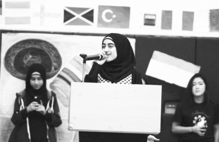 Photo by Ruby StaufferSenior Nour Judeh speaking at the multicultural assembly earlier this school year. She got involved with multicultural club this year, though it has been the most positive high school experiance for her.