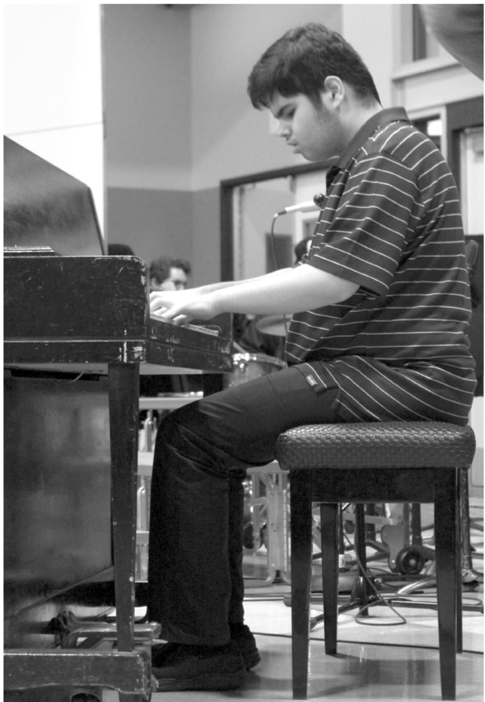 Miles WhitworthJunior Erfan Jazizadeh Karimi playing piano in Jazz Band II at the 58th annual Ballard Performing Arts Spaghetti dinner.