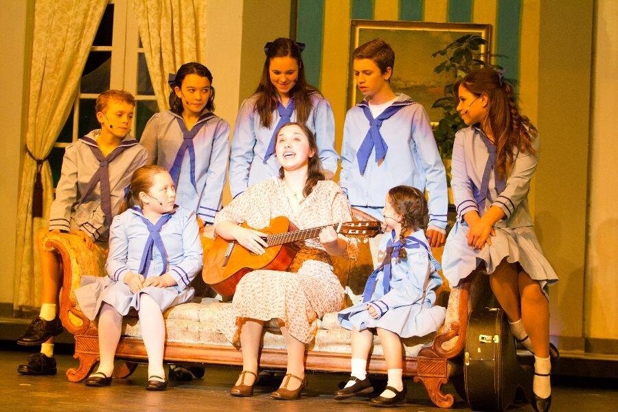 Evan Bunnage  The Von Trapp children join in a musical number with Maria Ranier, played by senior Natalia Roberts-Buceta.