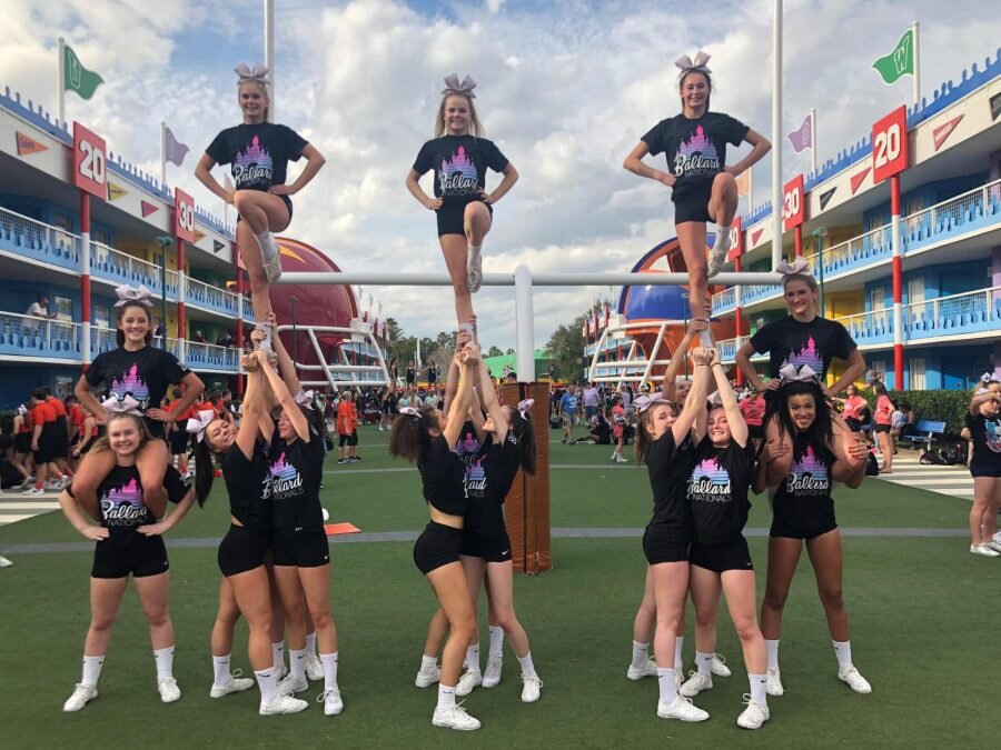 Samantha NietoThe Black cheer team practices stunts on the warm up field before competing at the 2018 Nationals. Located at Disney World, the team placed 13th in the Nation in medium D1 tumbling division.