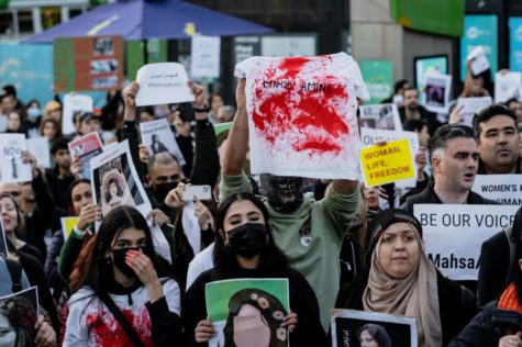 Demonstrators protest in solidarity with Iranian women after a woman was killed at the hands of the morality police.