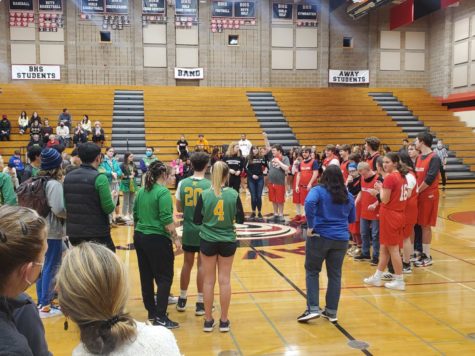 Players from BHS  gather with the Roosevelt Rough Riders at the end of the Unified basketball game to receive
sportsmanship awards.