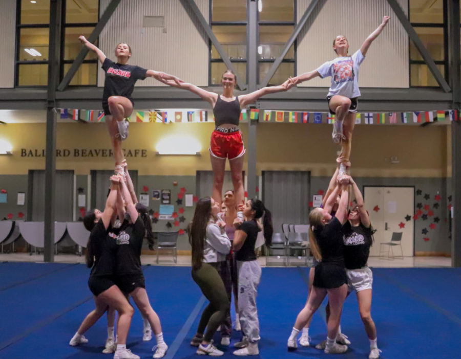 The Ballard High School cheer team practicing a pyramid for nationals.