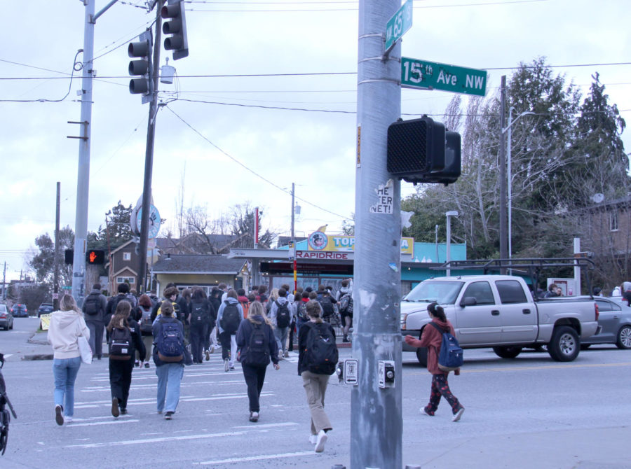 Students cross the street on 15th avenue after school to catch the Metro bus home.
