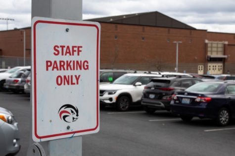 In staff-only parking lots, students who park their cars are given a green-sticker warning.