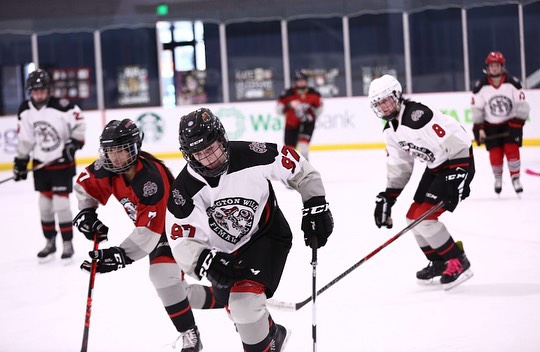 Senior hockey player Bella Neireiter (97) skating uprink in a 14U-19U intersquad Wild scrimmage. (Courtesy of Meg Patillo)