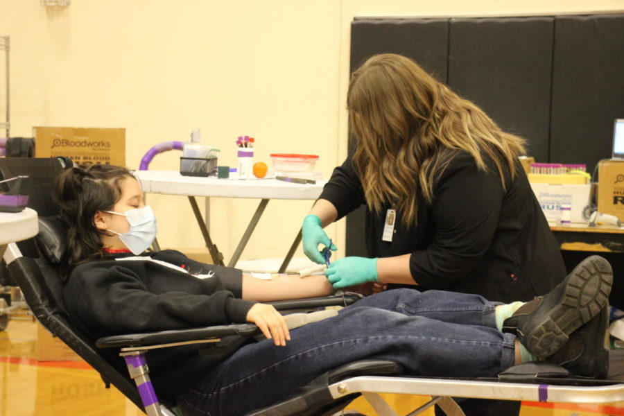 Izzy Kim (12) gets her blood drawn at NHS blood drive. Students
received service hours for organizing this event. 
