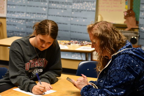 Current ASB Clubs Coordinator Addy Wynkoop (11, left) works with ASB adviser Laura Lehni (right) in the leadership class.