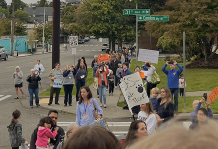 Magnolia community members rally for K-8 schools on Sept. 17, 2024 with the goal of keeping their schools open. 