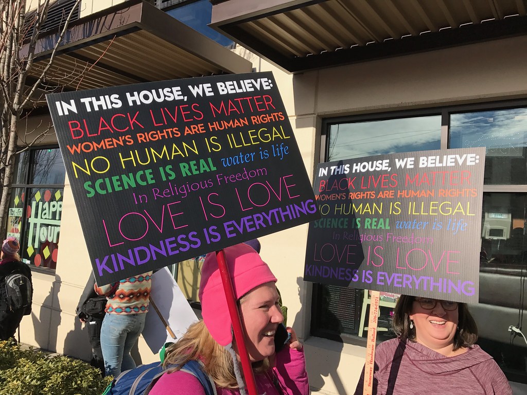 "In this home" signs have a nice message, but their actual weight is left undecided. Who actually changes their opinion based on these signs?