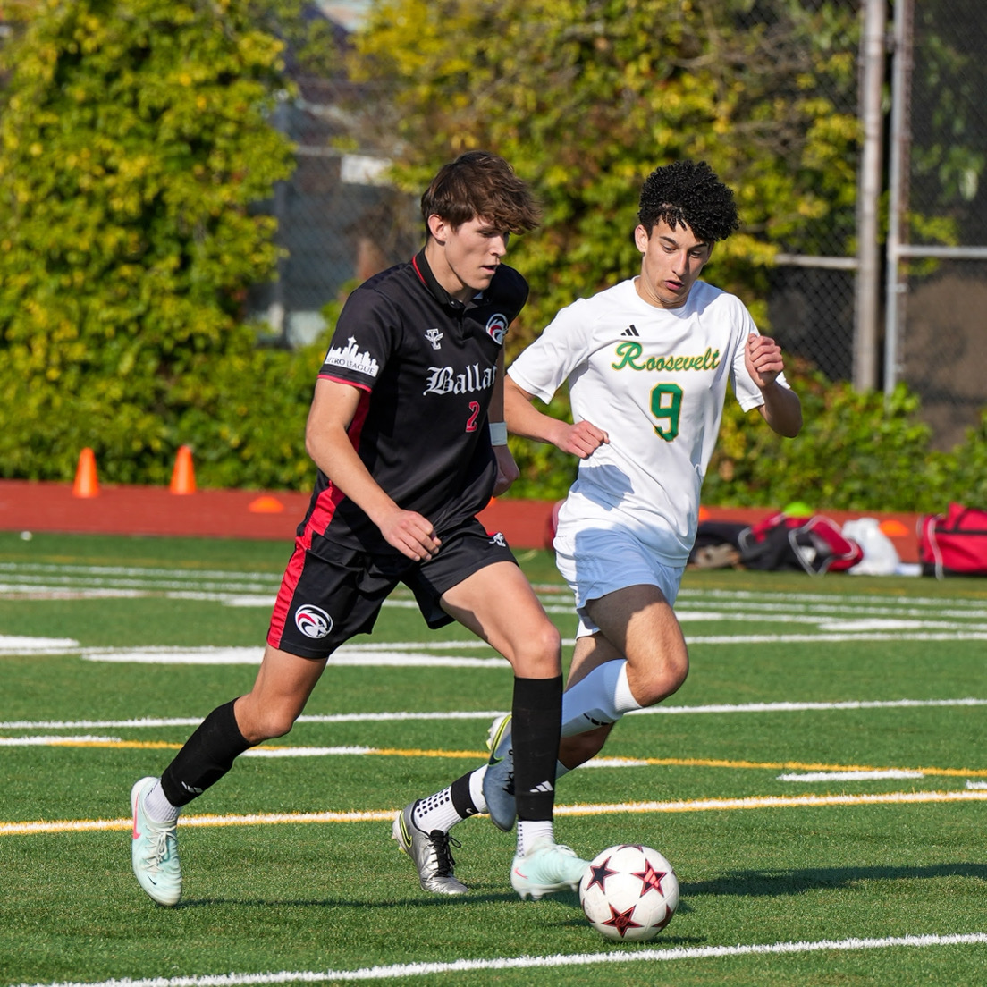 Senior and captain Owen Cutting sprints across the field, keeping the ball away from an opposing Roosevelt player. Midfield players adapt well when situations arise, helping the team’s success. (Courtesy of Steve Muench)