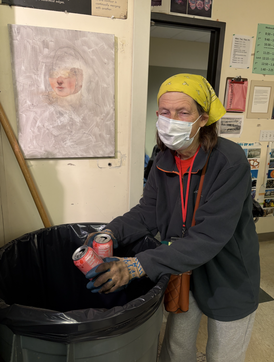With a cart full of cans, Norby makes her daily rounds through the classrooms she's been visiting for over 20 years.