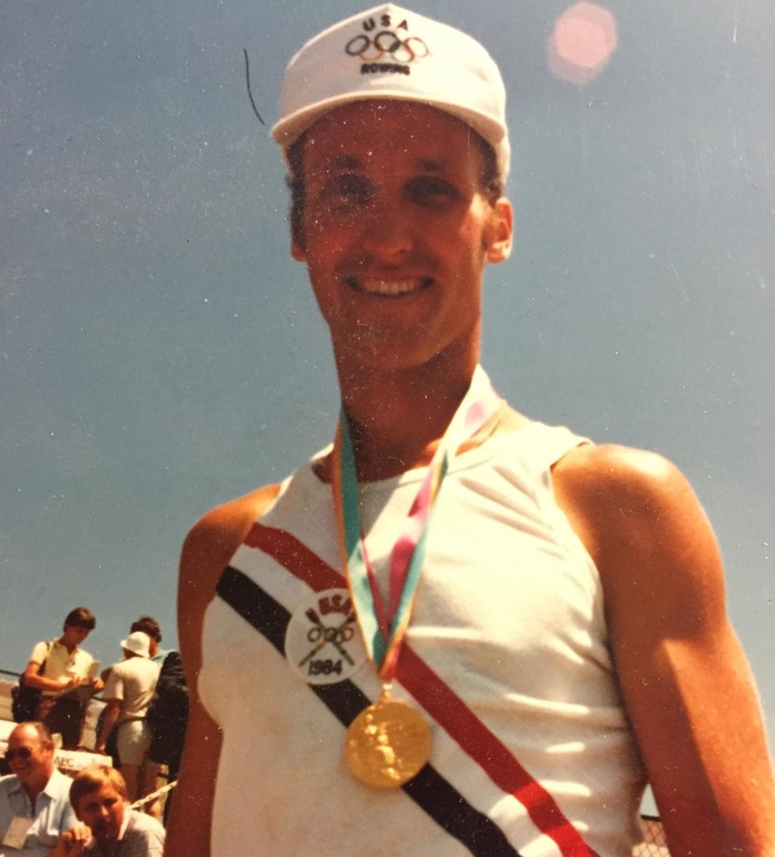 Olympic champion Paul Enquist smiles for a portrait with the gold medal he won in the men's double sculls at the 1984 Los Angeles Games. His historic victory alongside Brad Alan Lewis marked the first Olympic gold medal for any U.S. rowing crew since 1964. 